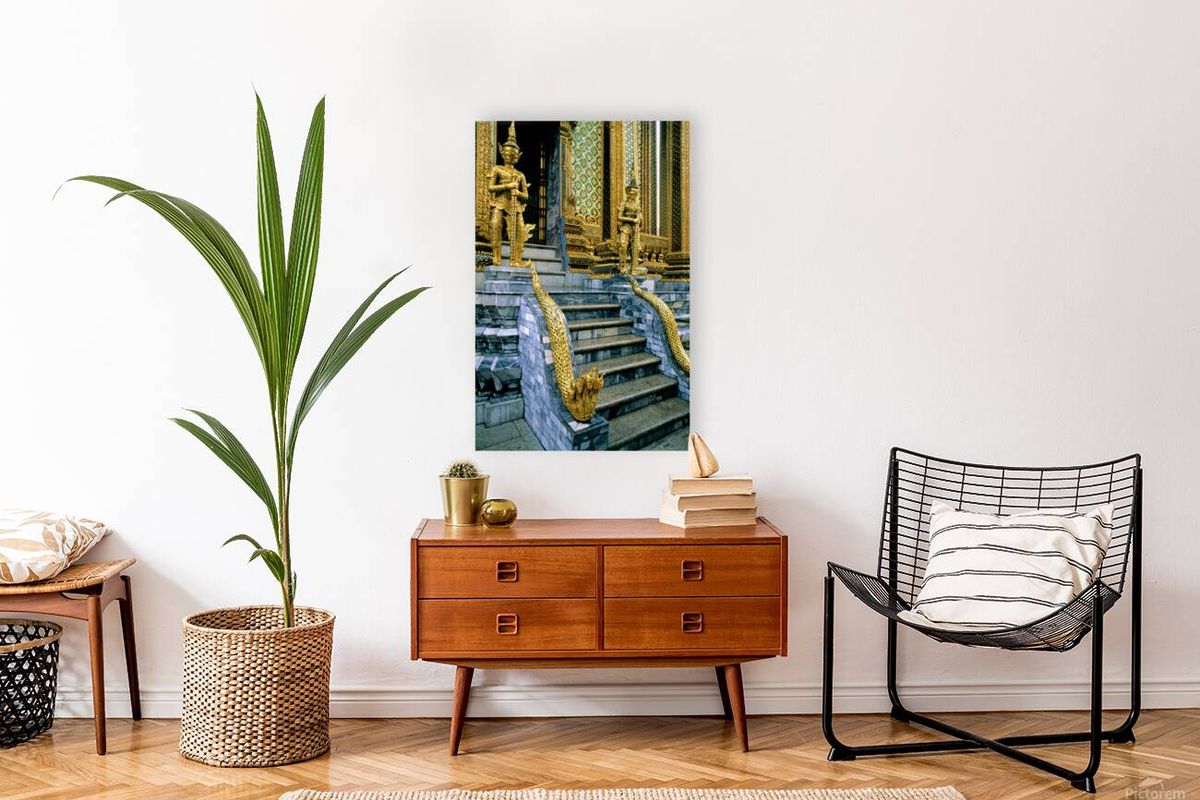 Gilded statues guard Wat Phra Kaew in Bangkok