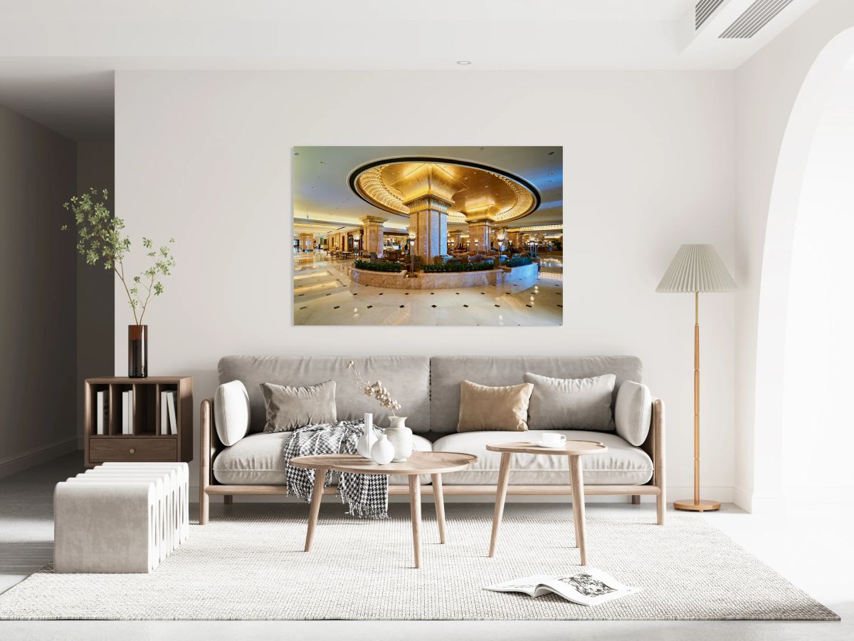 Luxurious hotel lobby with ornate gold and marble decor.