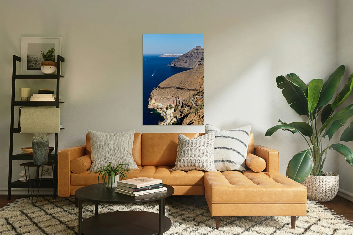 Santorini caldera with cliffs deep blue sea port and distant 