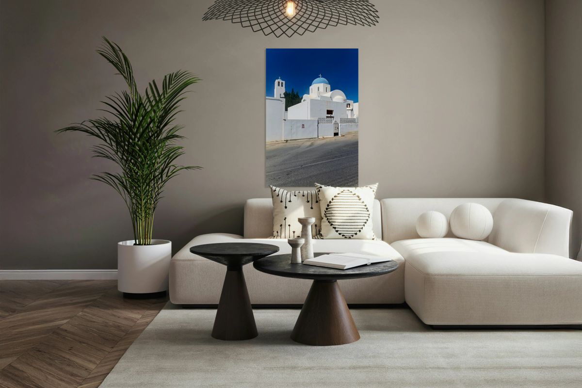 White church blue dome bell tower clear sky.