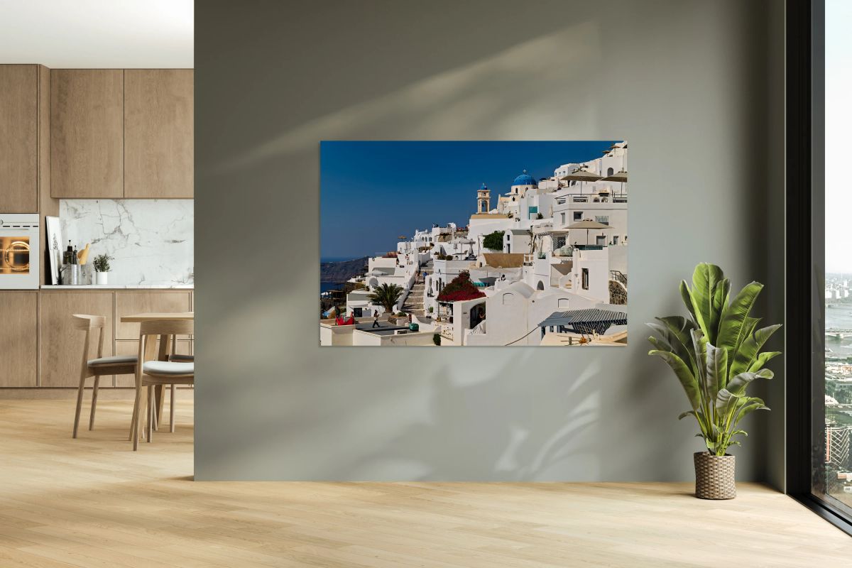 Santorinis iconic white buildings blue domes and caldera view