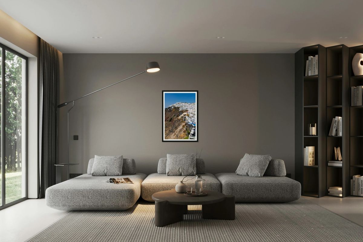 Whitewashed buildings cascade down Santorinis volcanic cliffsid