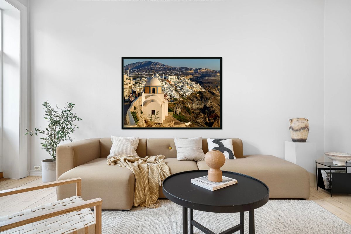 Scenic Santorini cliffside town with church and distant mountain
