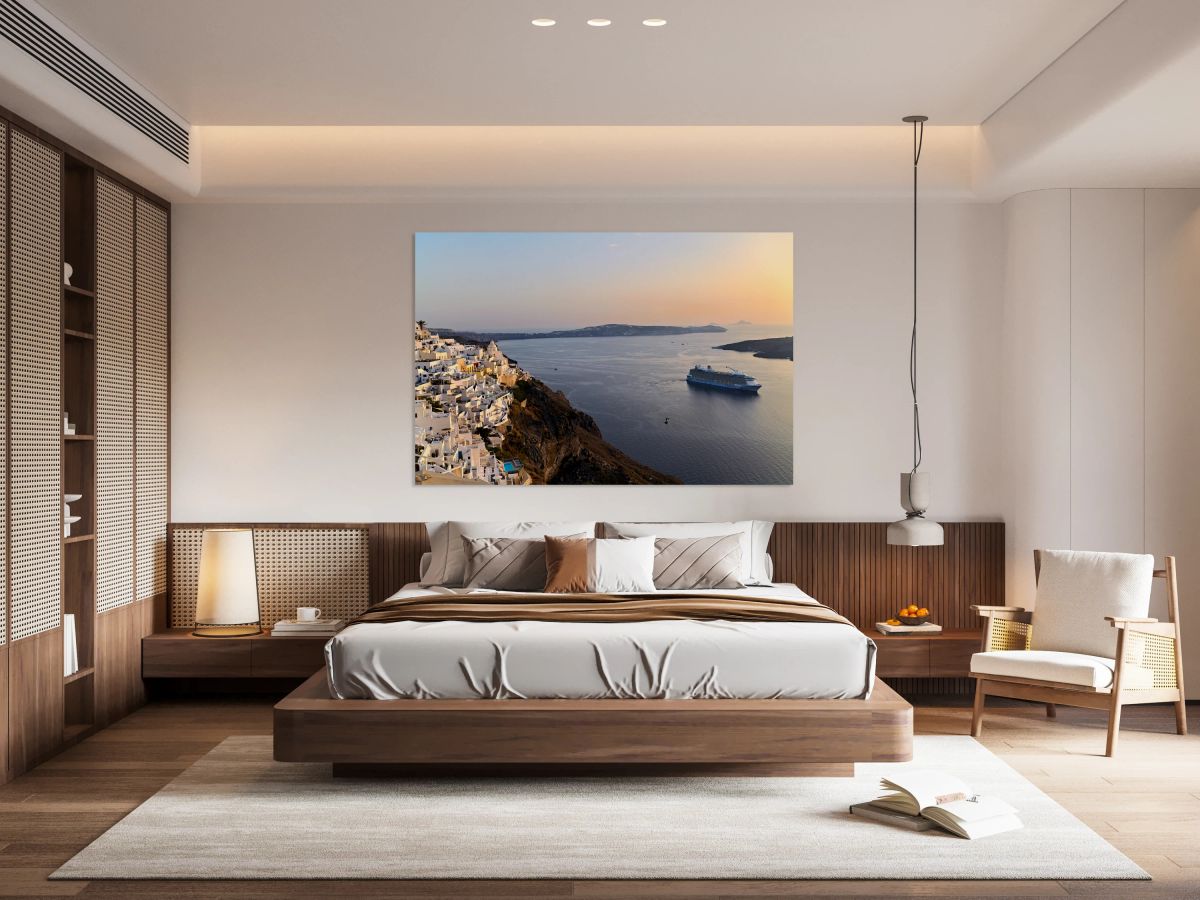 Santorini village and cruise ship at sunset.