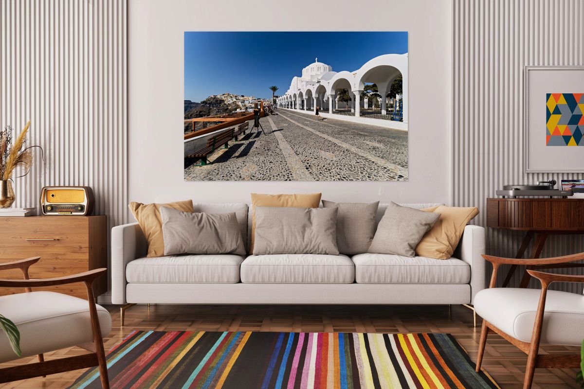 Santorinis iconic white church cobblestone path and cliffside