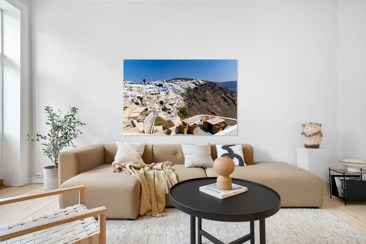 Santorinis iconic white village on a cliff overlooking the cald