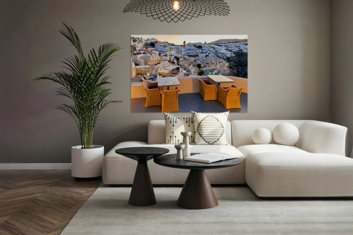 Santorini village at dusk illuminated with outdoor dining terr