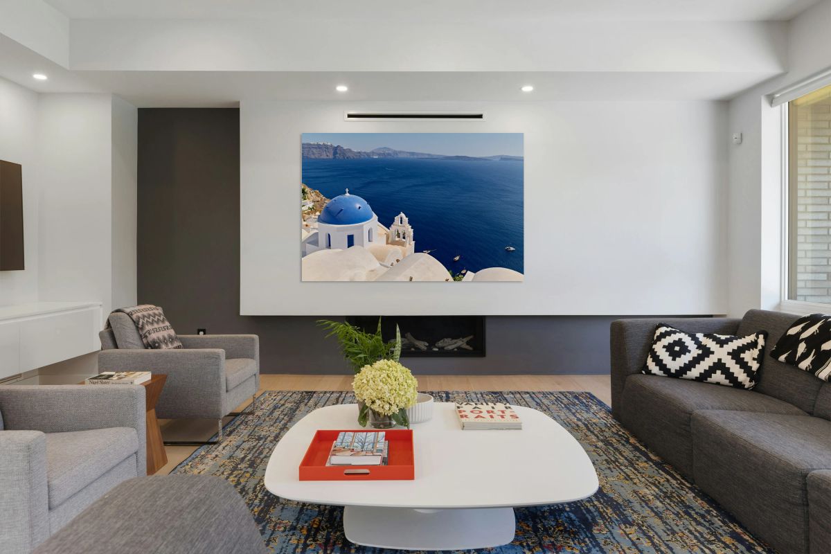 Santorini blue domed church overlooking the Aegean Sea and calde