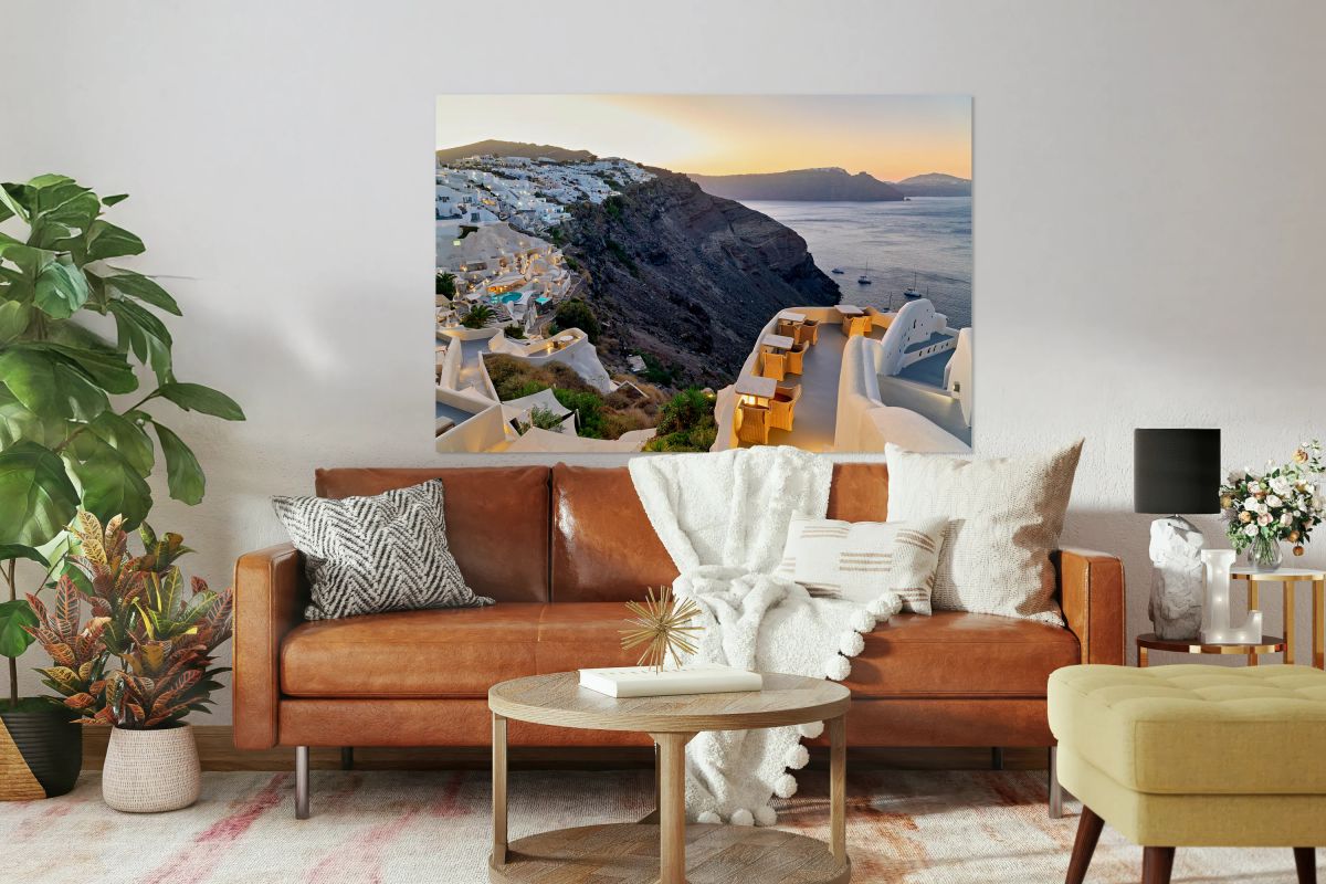 Sunset over Santorinis white village and caldera.