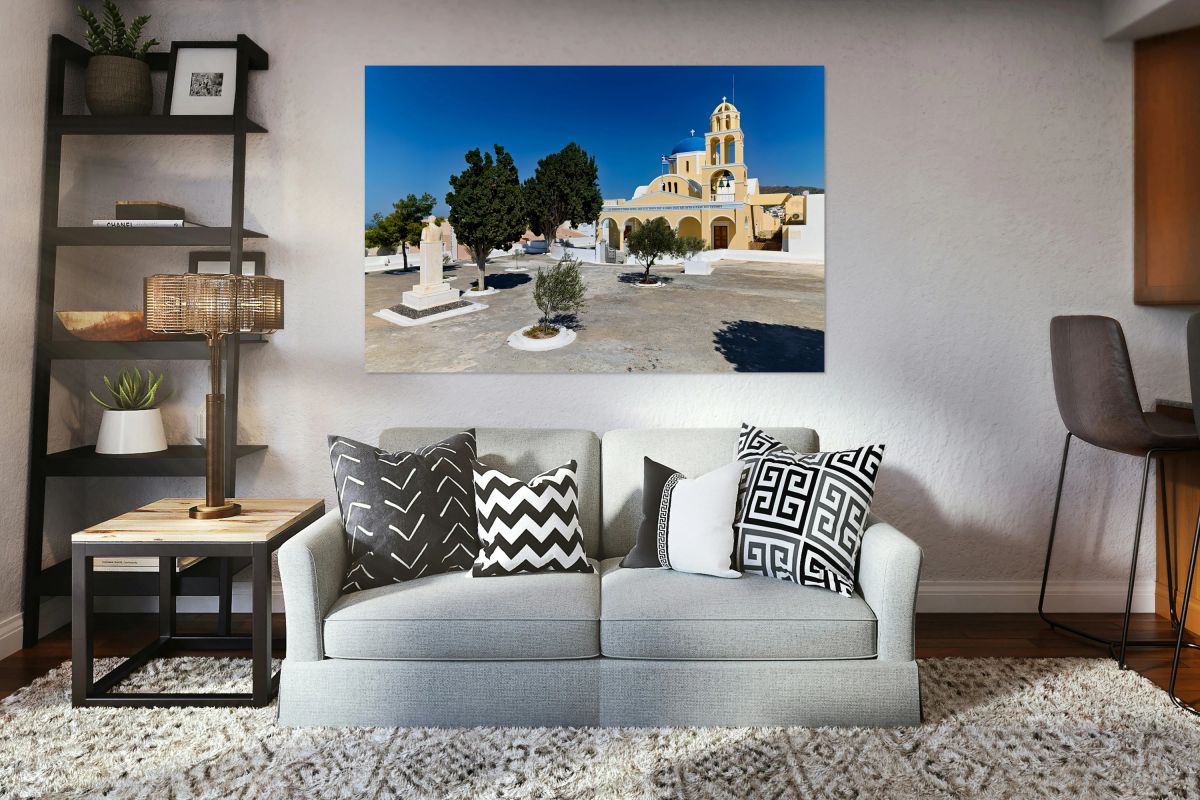 Traditional Greek church blue dome bell tower sunny day.