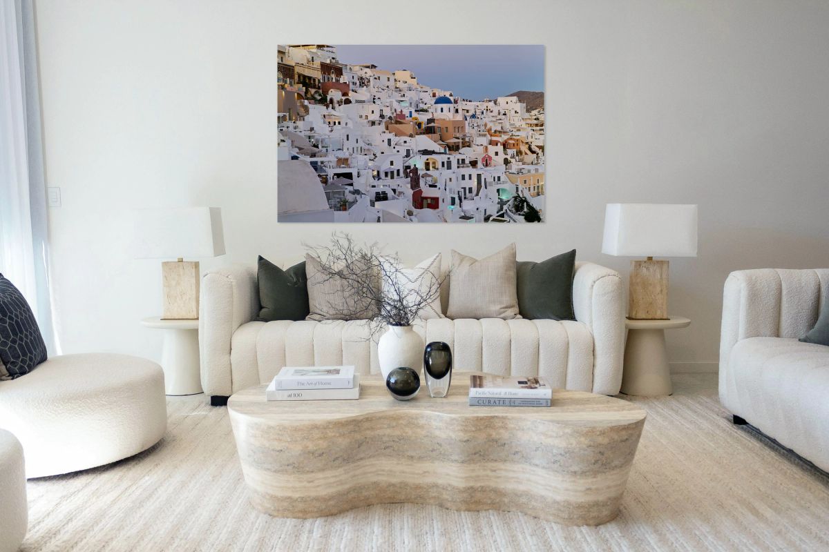 Santorinis iconic white buildings and blue domes on a hillside.