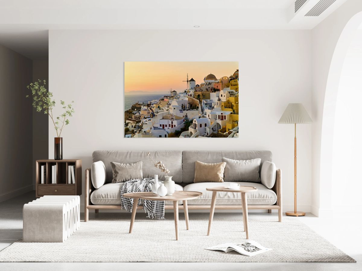 Whitewashed Santorini village and windmills at sunset over the s