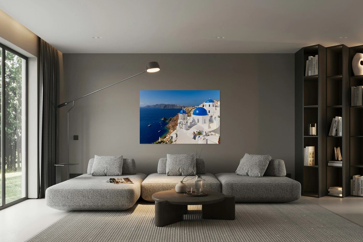 Picturesque Santorini: blue domes white buildings and caldera 