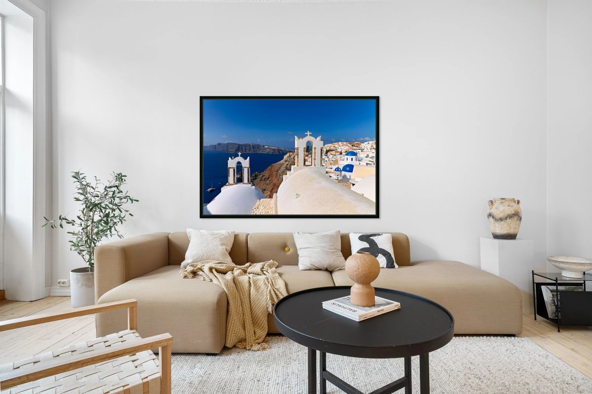 Santorinis iconic white churches blue domes and caldera view.