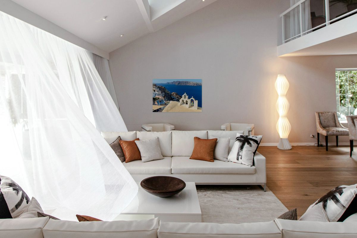 Picturesque Santorini village church bells and deep blue sea.