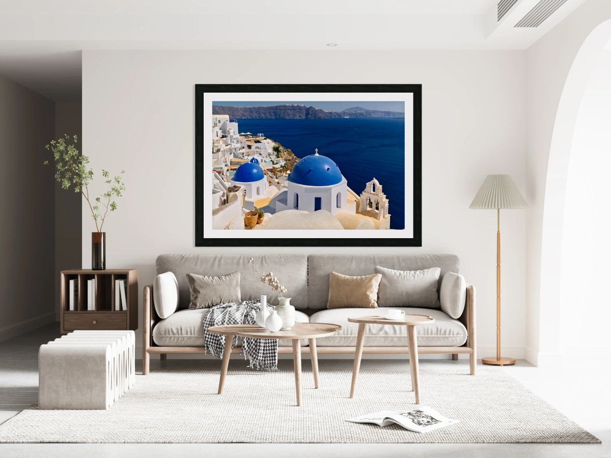 Beautiful Santorini: White buildings blue domes and deep blue 