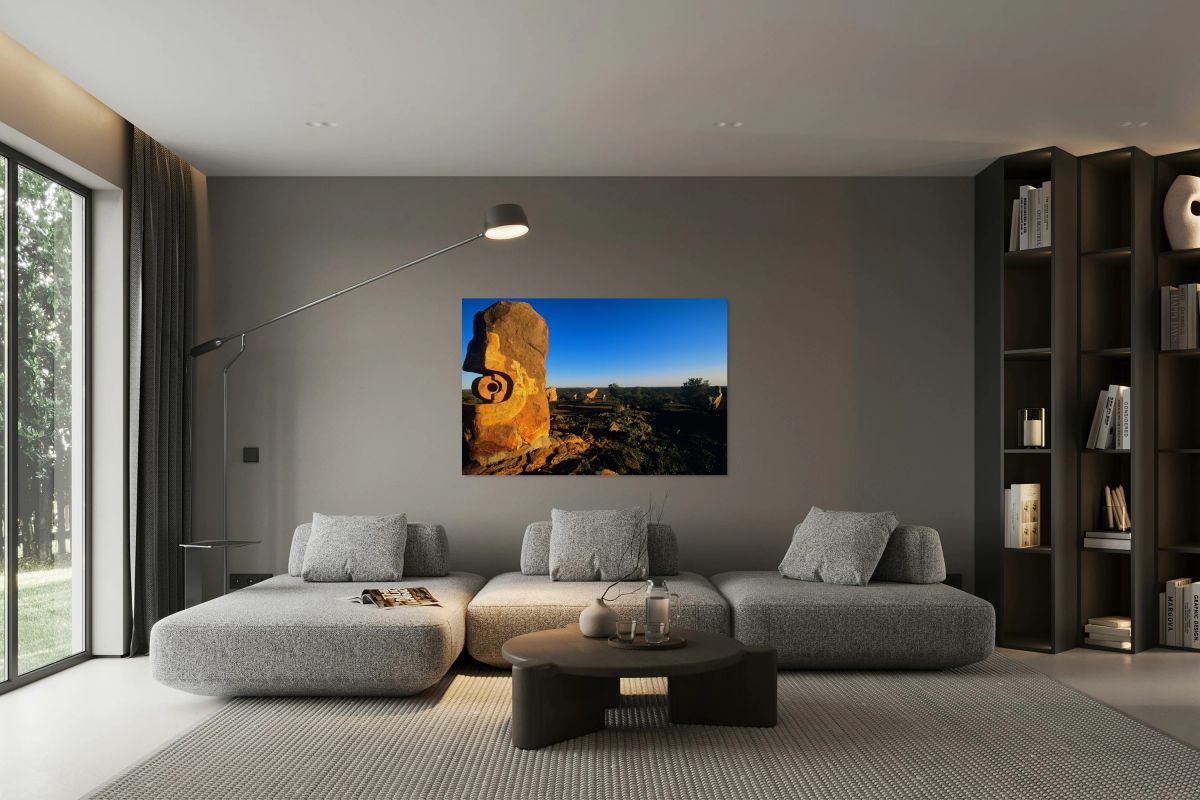 Sandstone sculptures glow at sunset in the Australian outback.