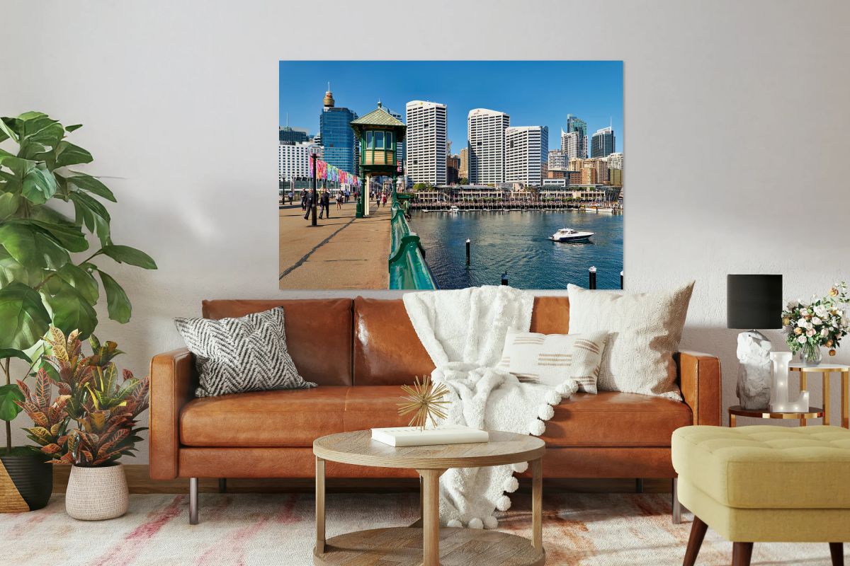 Sydney Harbour with boats and buildings on a sunny day.