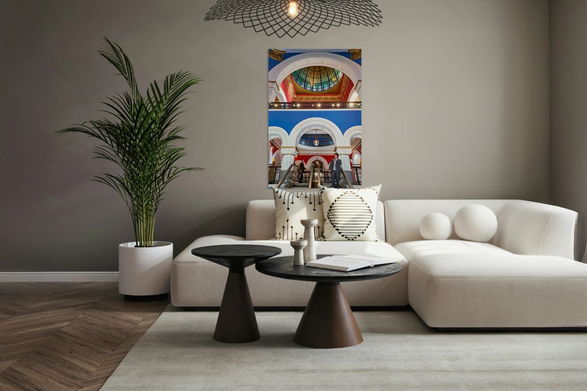 Men ride escalators in Queen Victoria Building in Sydney
