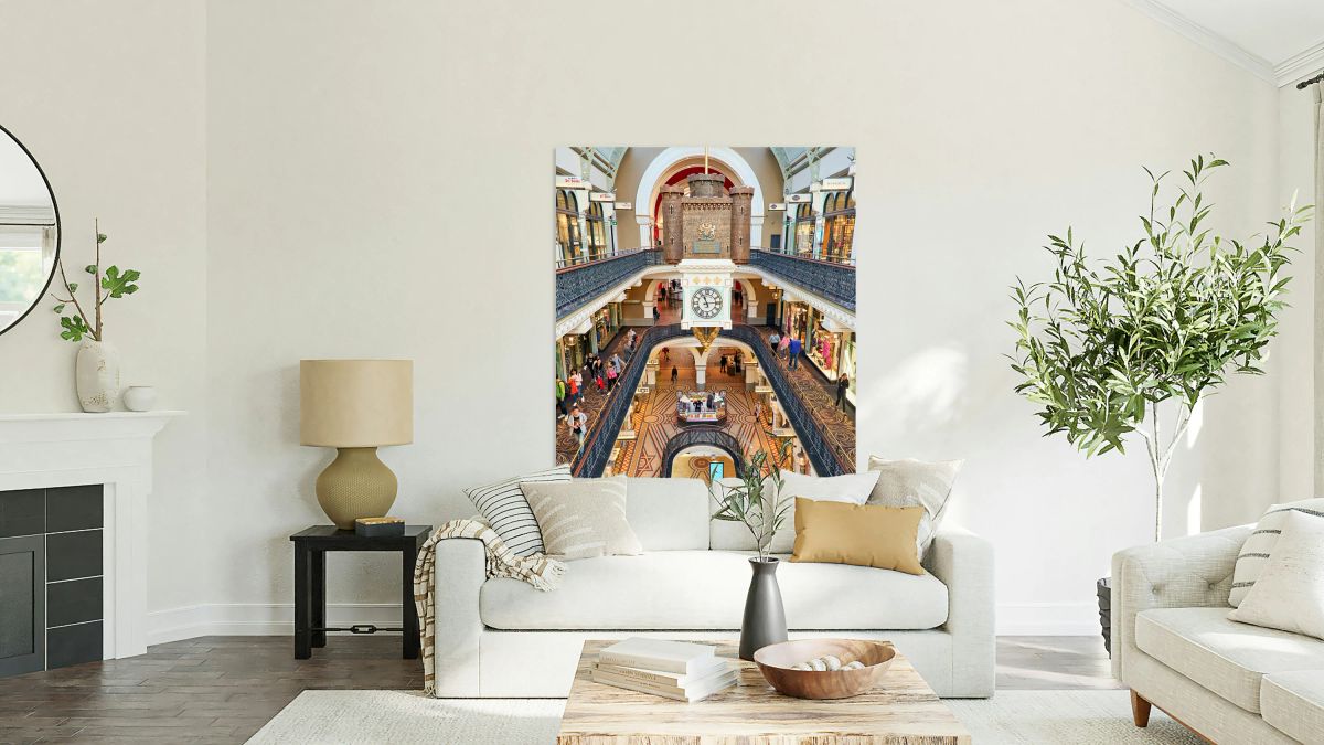 Elegant interior of a multi level shopping arcade with clock.