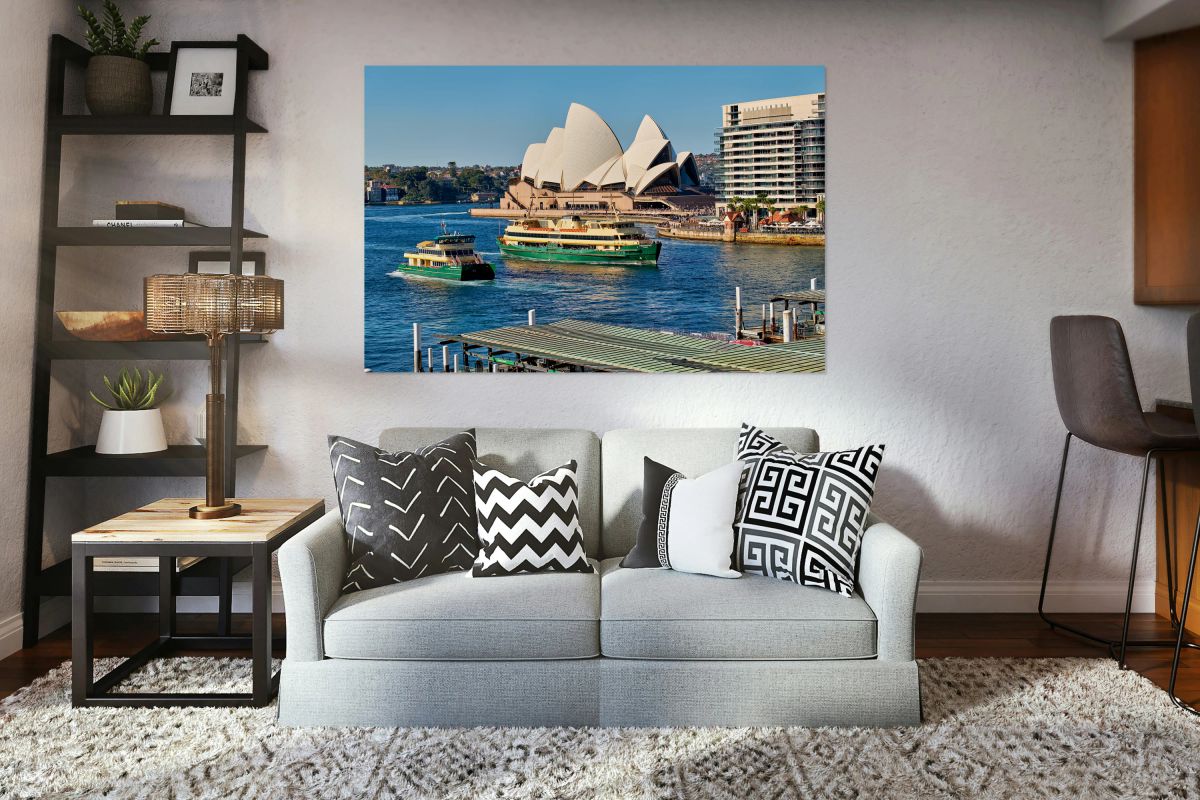 Sydney Opera House and ferries on a sunny day.