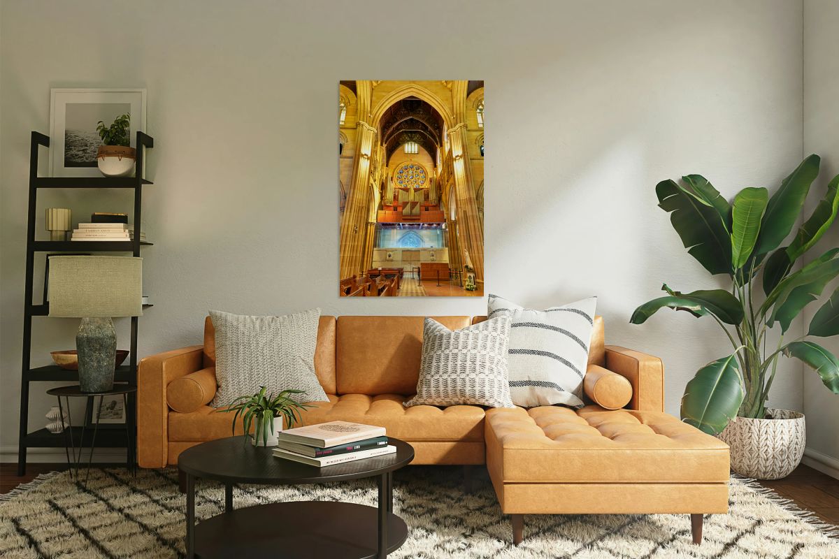 Interior of a grand cathedral with pipe organ and stained glass.