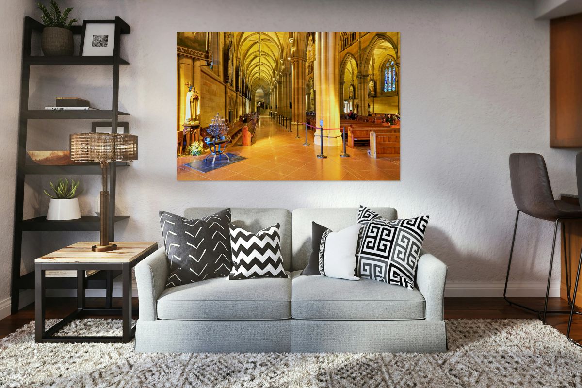 Interior of a grand cathedral with pews and stained glass.