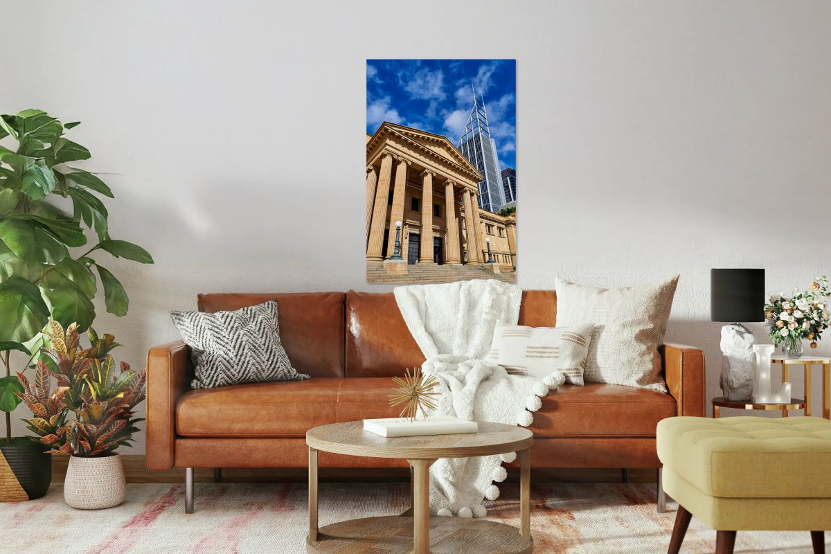 Classical building facade with modern skyscraper behind.