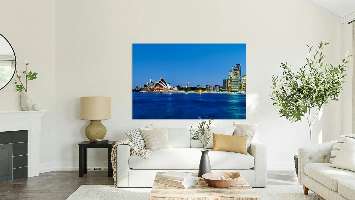 Sydney Opera House and city skyline at dusk.