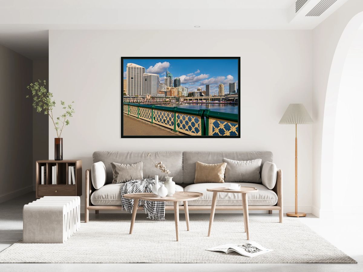 Sydney Harbour skyline with modern buildings and water.