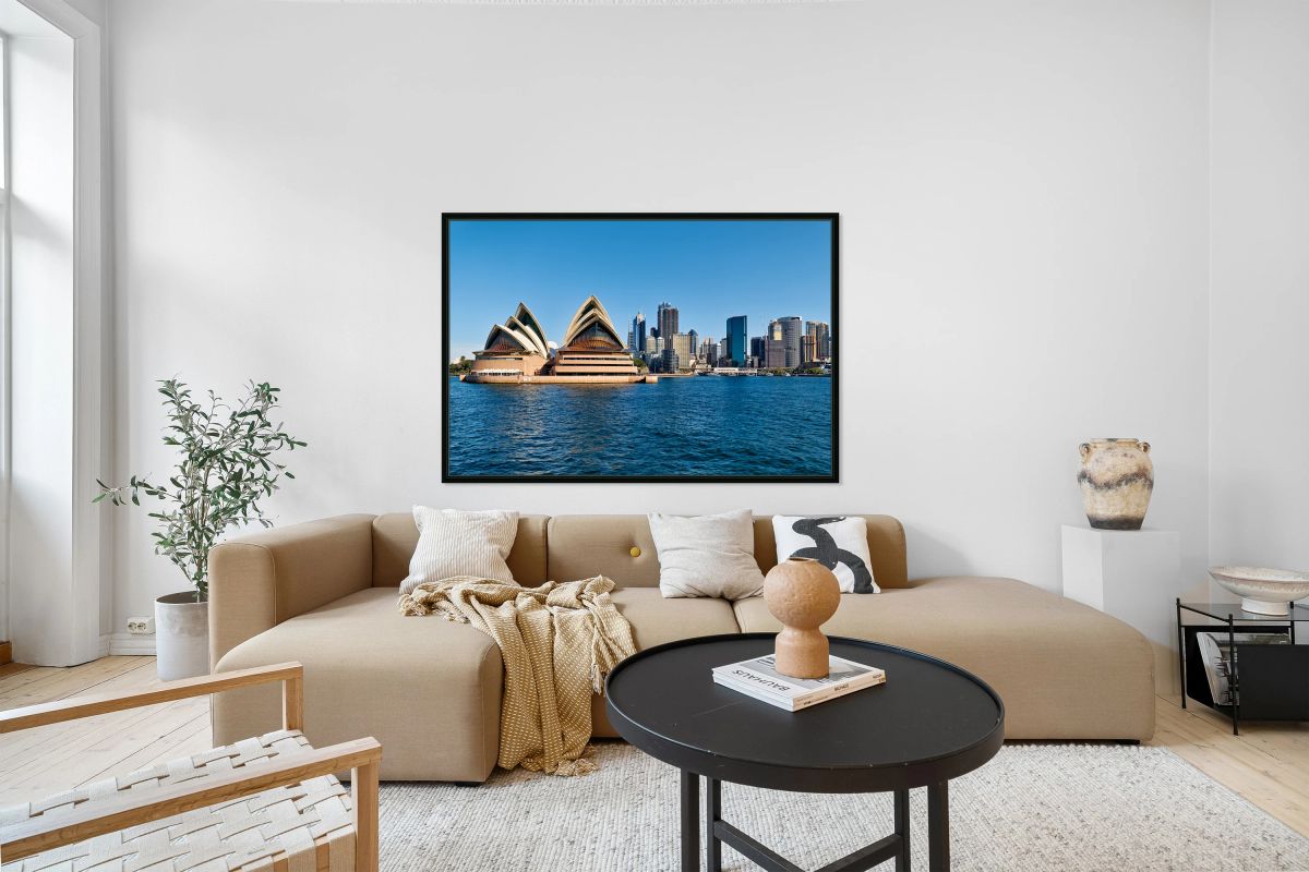 Sydney Opera House and city skyline across the harbor.