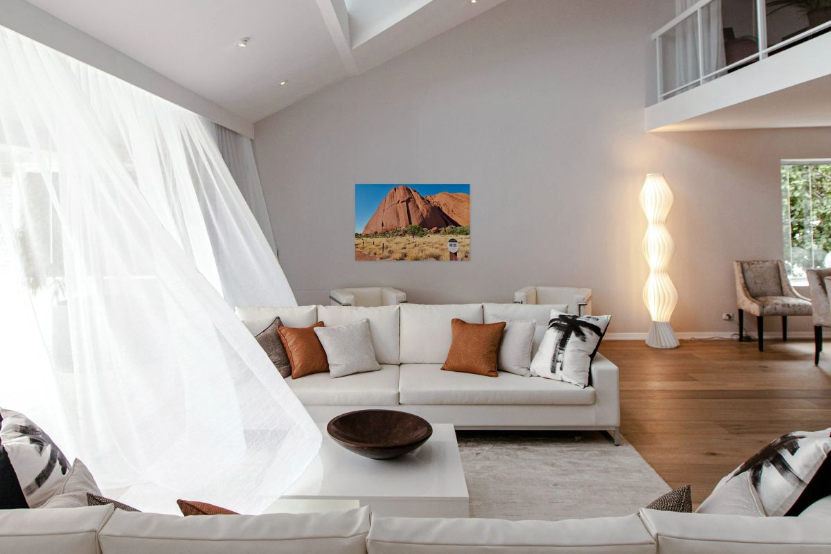 Uluru Australia a sacred monolith under a clear blue sky.