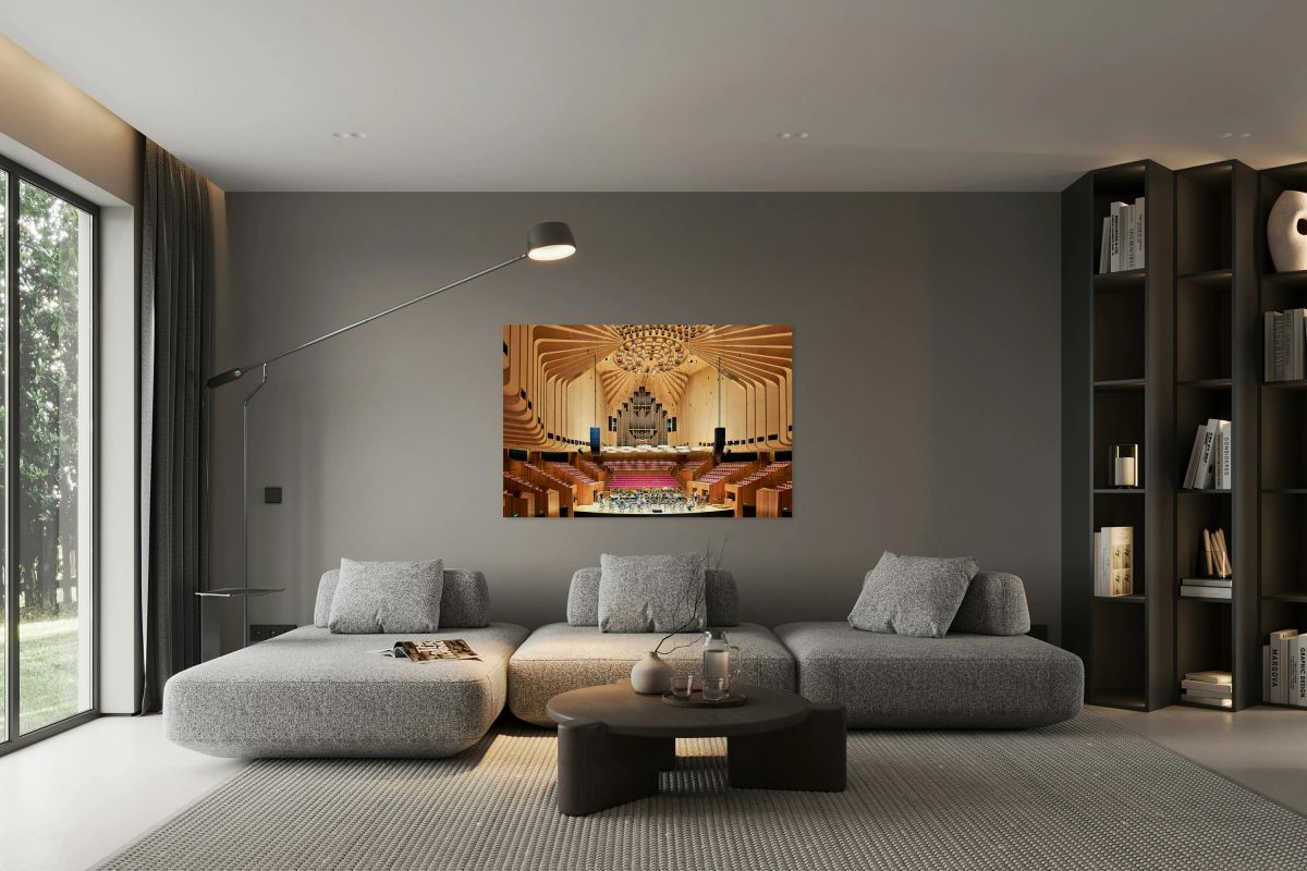 Orchestra rehearses in a modern concert hall with wooden interio