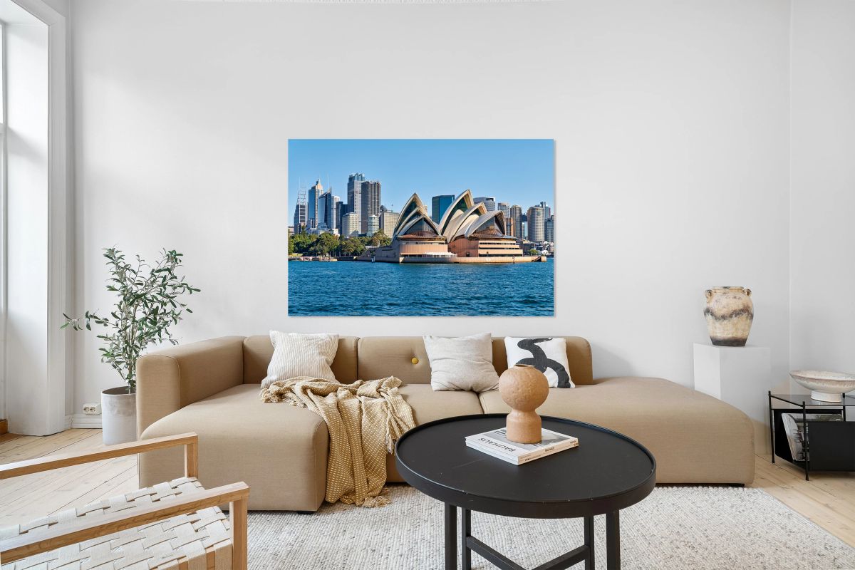 Sydney Opera House and city skyline on a clear day.