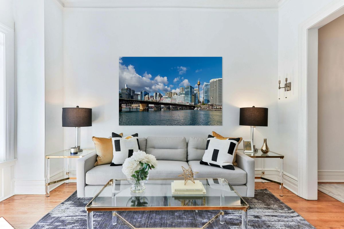 View of Sydney Harbour with bridge and city under blue sky