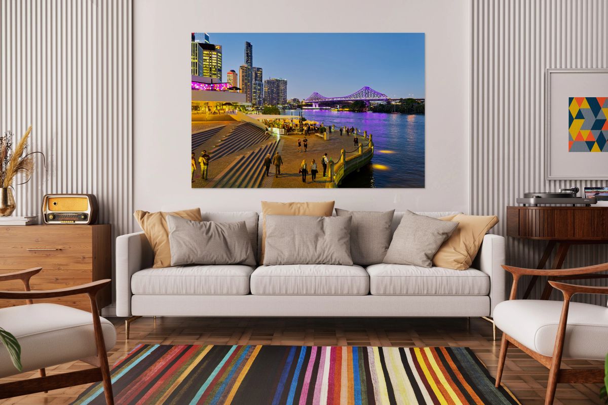Brisbanes Story Bridge and riverfront promenade bustling at nig