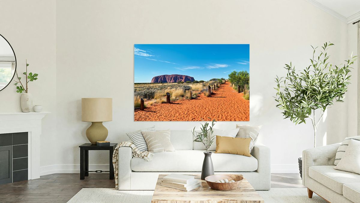 Uluru Australia: A path leads towards the iconic sandstone mono