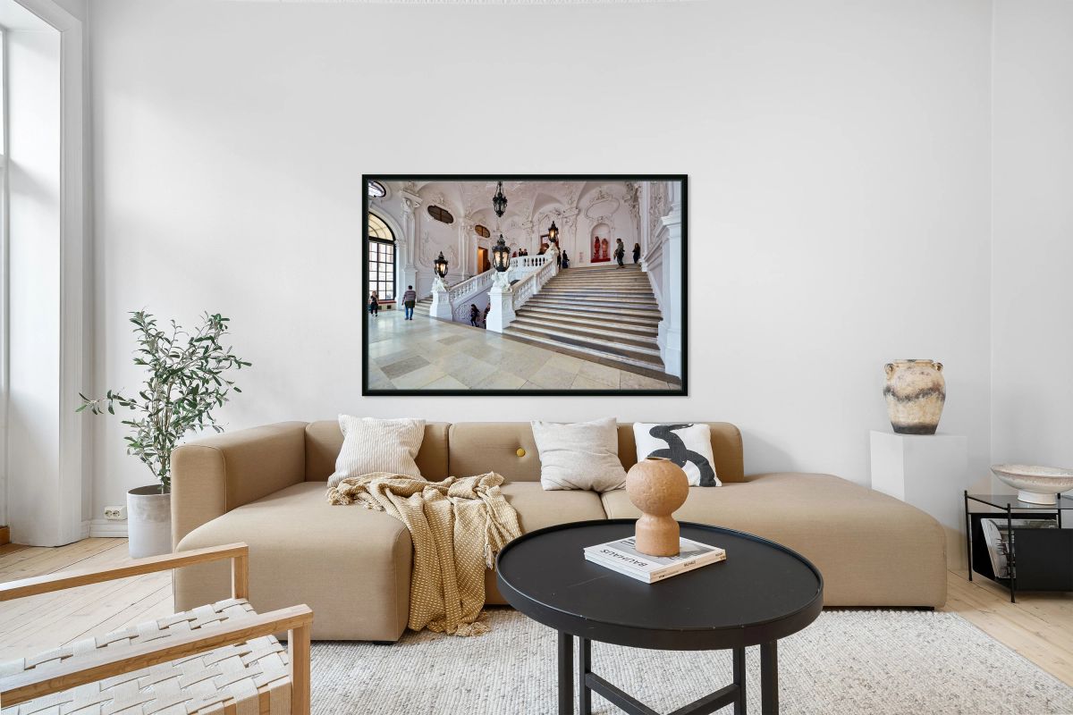 Visitors exploring a grand ornate staircase in a historic palac