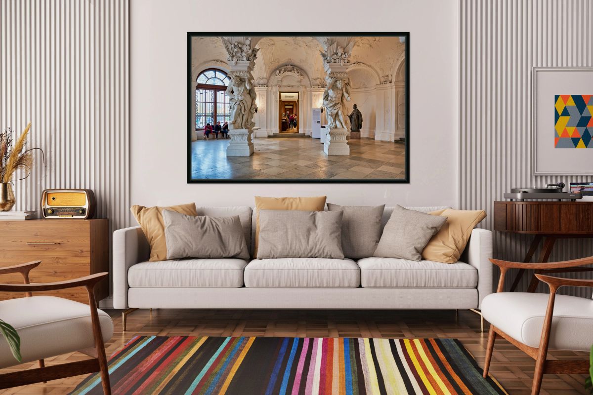 Ornate Baroque hall with sculptures and visitors.