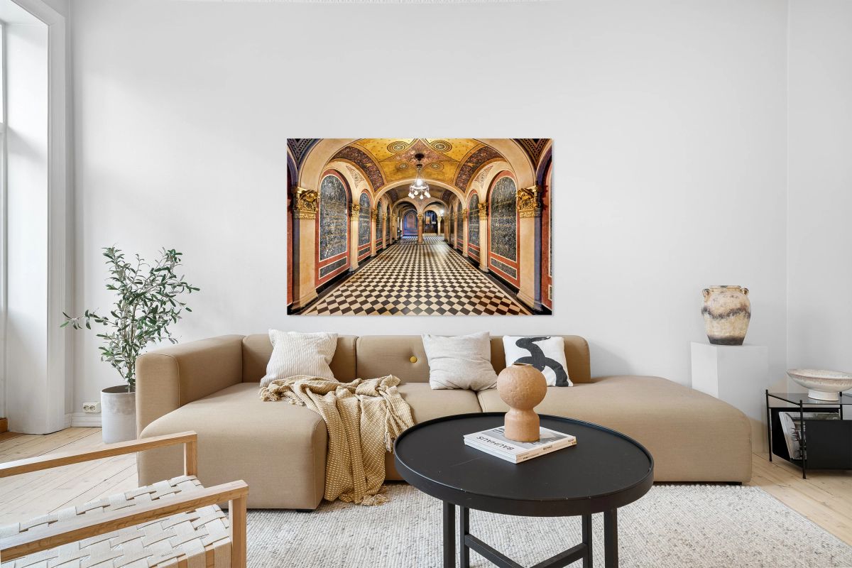 Historic church corridor with ornate arches and checkered floor.