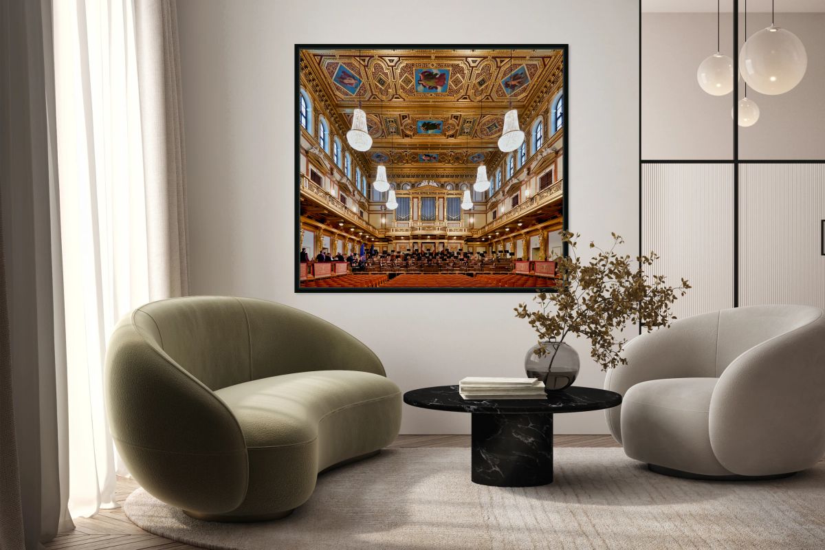 Ornate grand concert hall with organ chandeliers and empty se