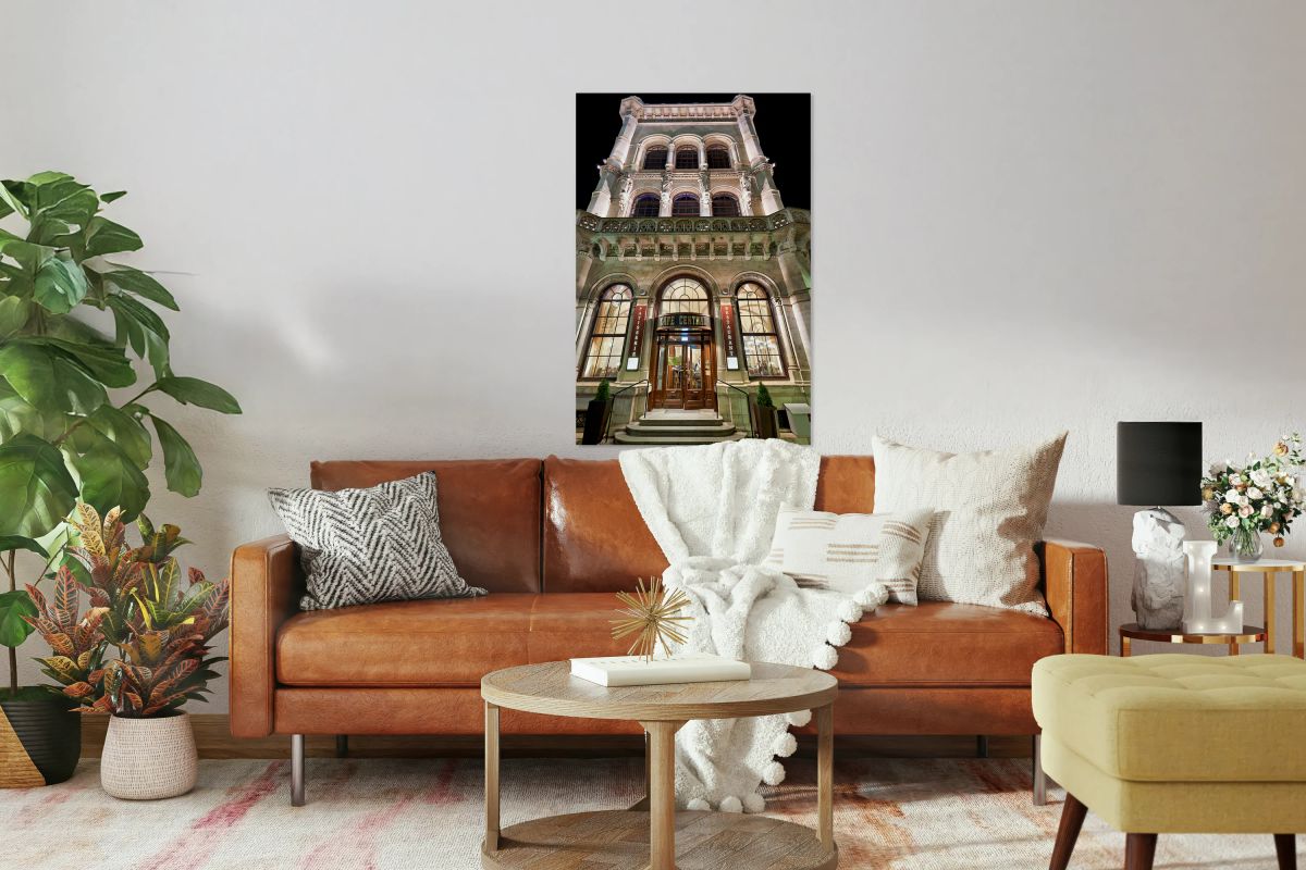 Grand Cafe Central building illuminated at night.