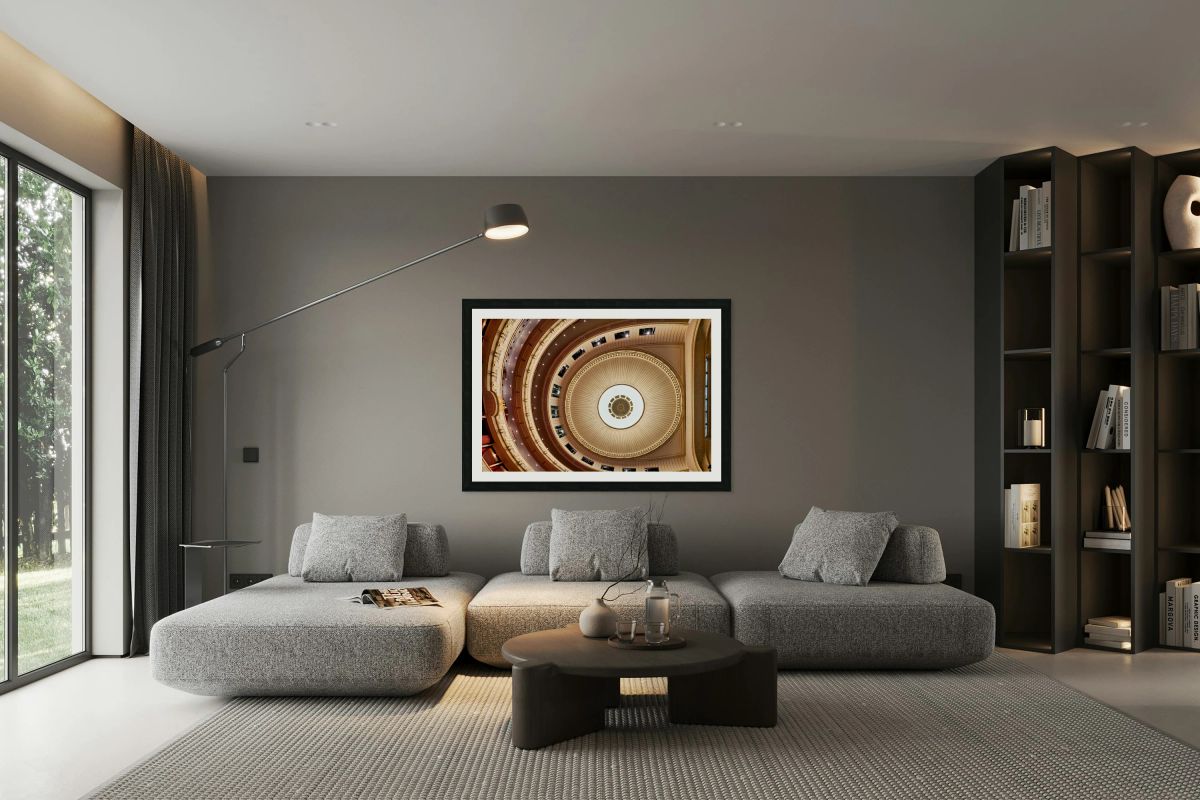 Ornate theater ceiling and balconies viewed from above.