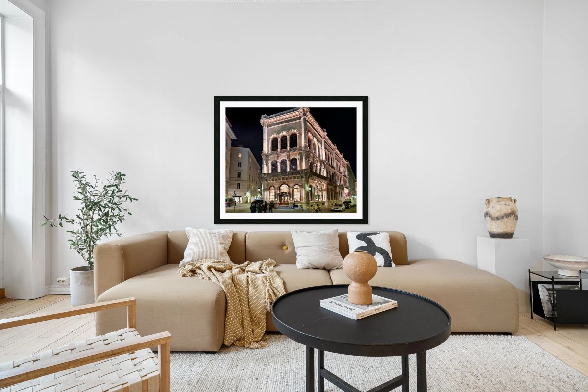 Viennas Cafe Central illuminated at night with police and peop