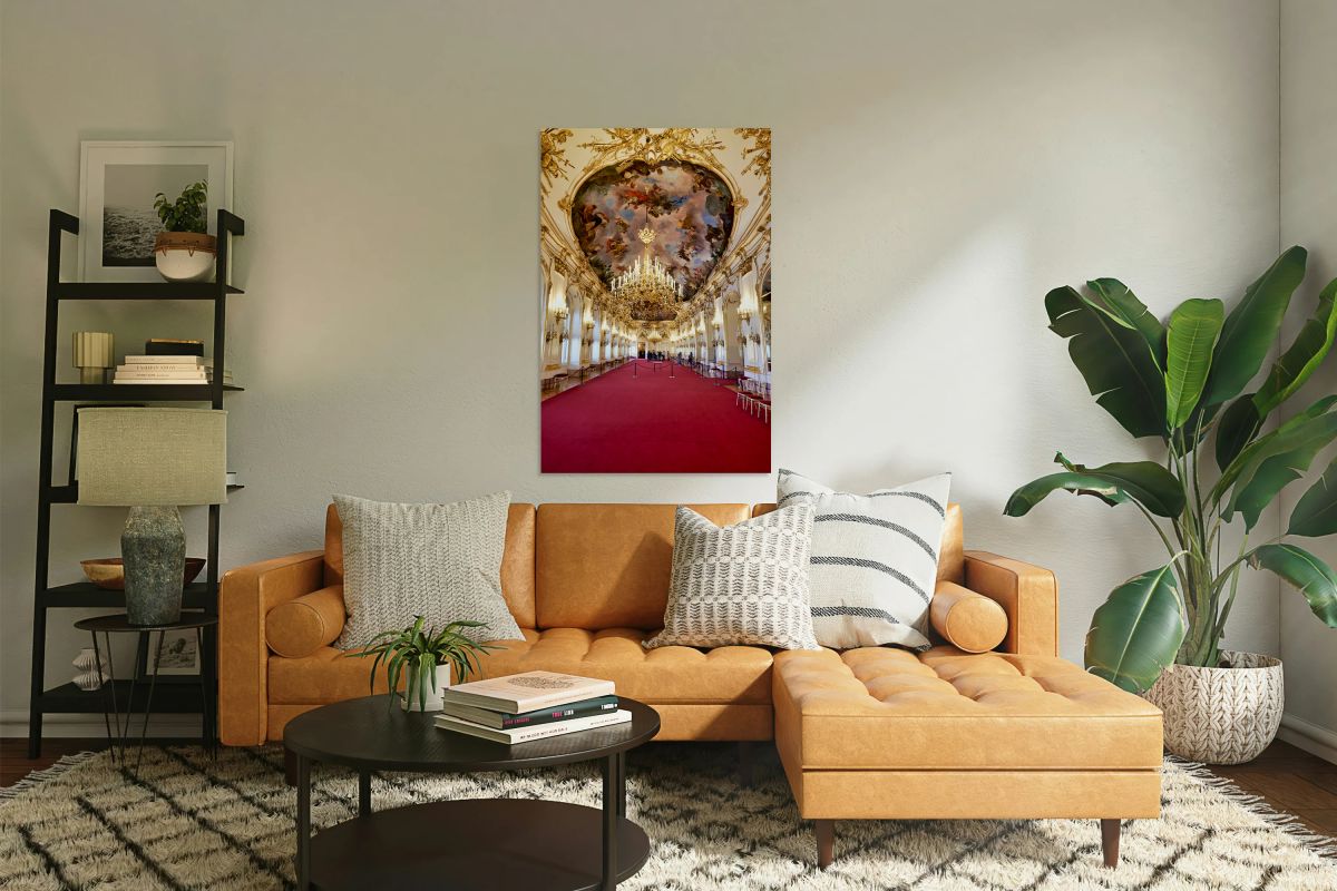 Ornate palace hall with chandeliers painted ceiling and red ca