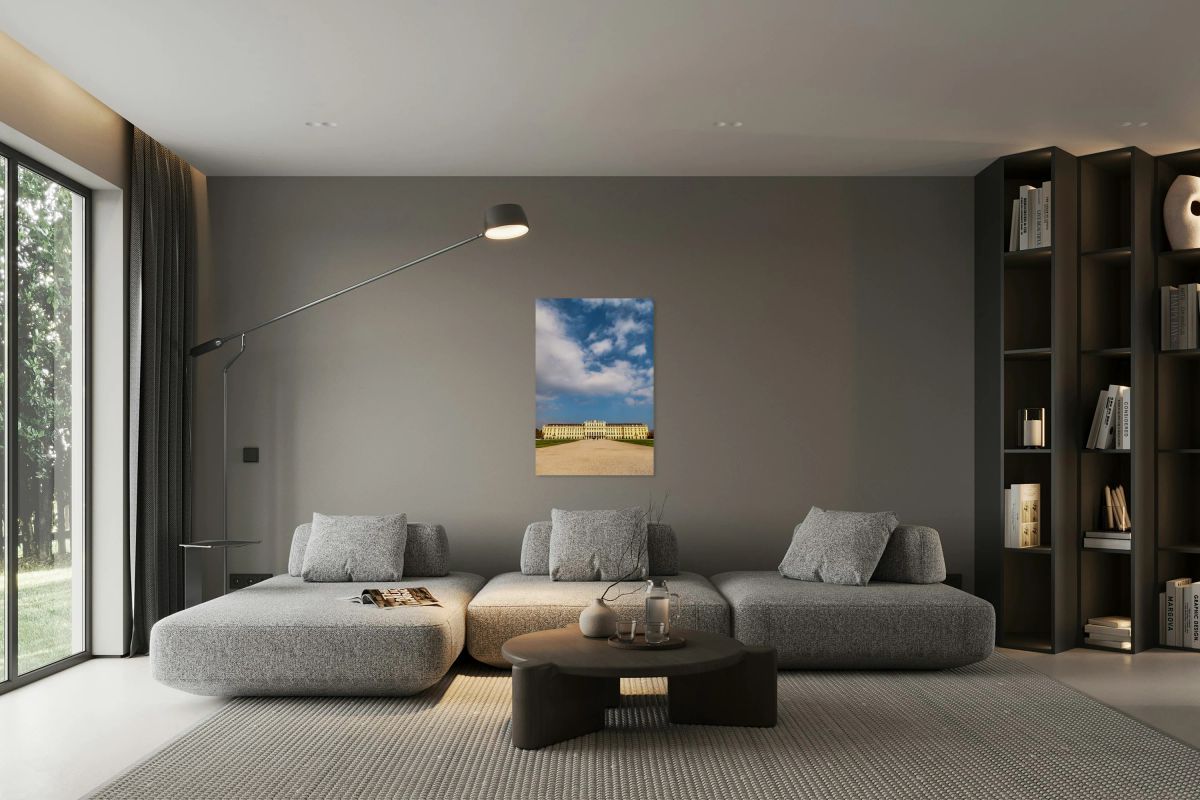 Schönbrunn Palace and gardens under a beautiful cloudy sky.