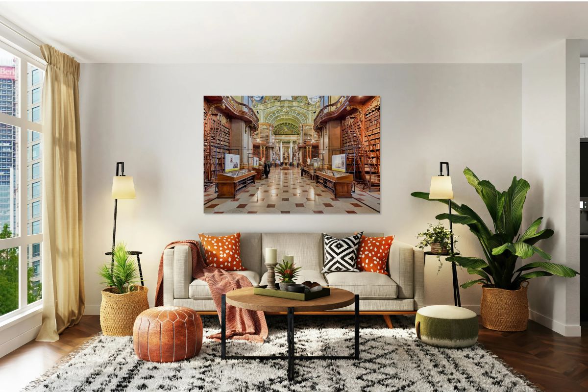 Ornate historic library interior with towering bookshelves and v