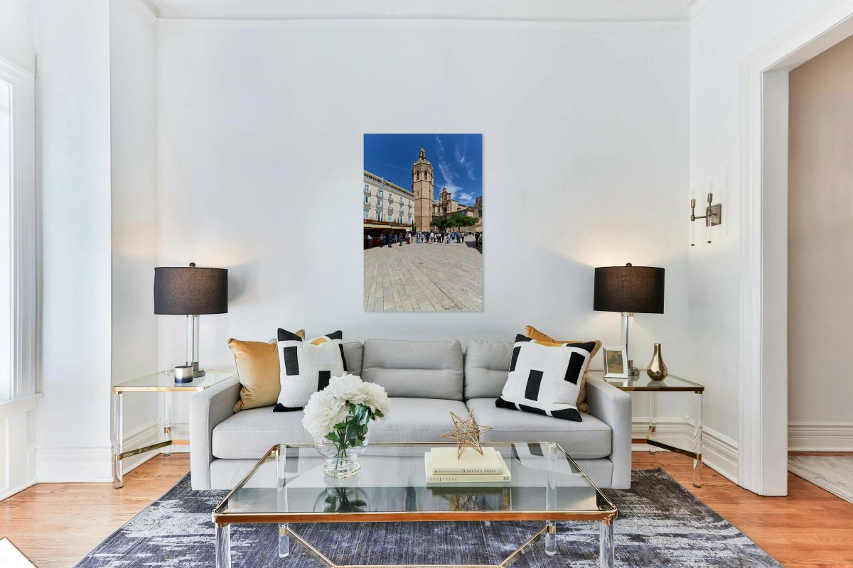 Valencia Cathedral tower stands tall in the plaza with many visi