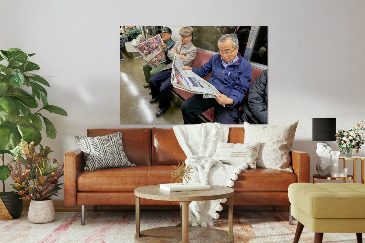 Tokyo subway commuters reading newspapers in the morning