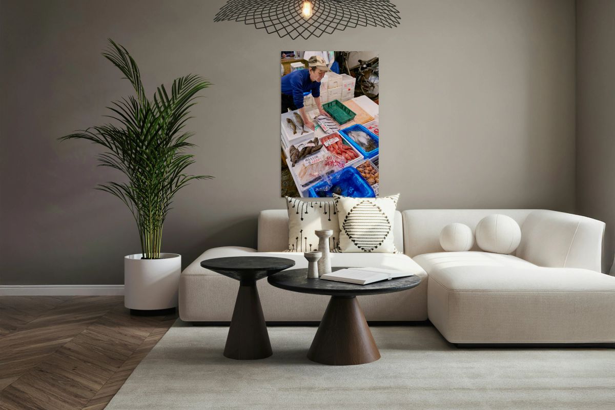 Fish market activity in Tokyo shows vendor and fresh seafood dis